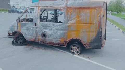 Abandoned rusty van in urban parking lot side view, commercial vehicles, urban Stock Footage 345202979
