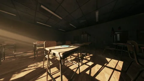 Abandoned school classroom bathed in sunlight with empty desks and chairs Stock Footage 327190379