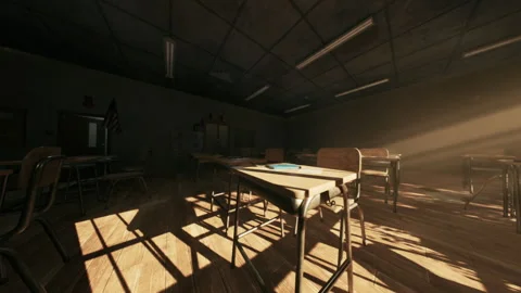 Abandoned school classroom with empty desks and sunlight streaming in Stock Footage 295931253