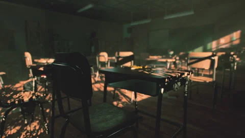 Abandoned school classroom with empty desks and fading light at dusk 스톡 동영상 327190389