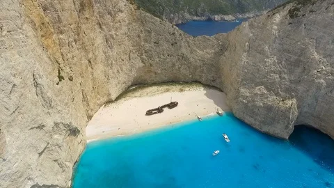 Abandoned ship on white sandy coast in mediterranean sea Stock-Footage 98737863