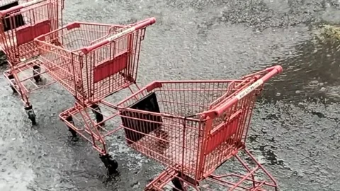 Abandoned shopping carts in the rain Stock Footage 292823231