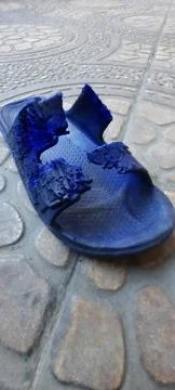 Abandoned slippers Stock Photos