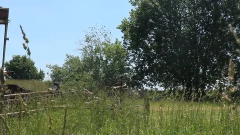 Abandoned Soviet harvester in the grass Stock Footage 97784531