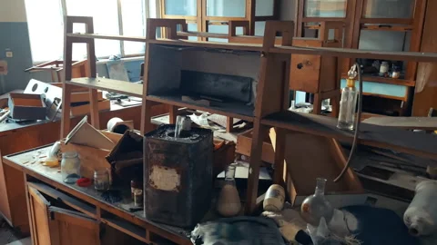 Abandoned Soviet Science Lab with Empty Wooden Shelving Units and Scattered Stock Footage 336933179