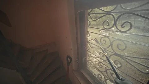 An Abandoned Staircase Featuring a Stunning Window View that Captivates the Stock Footage 314573863