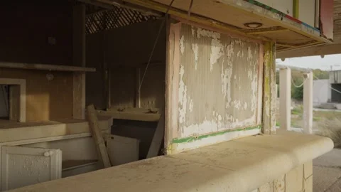 Abandoned stall with peeling paint and broken counter Stock Footage 337034051