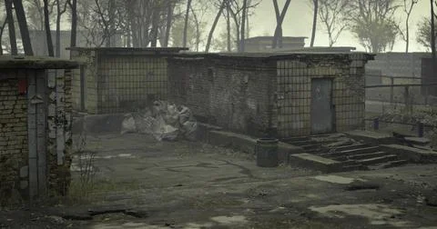 Abandoned structures in a desolate area under overcast skies Stock Illustration