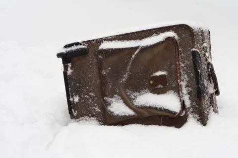 Abandoned Suitcase Under Snow 写真素材
