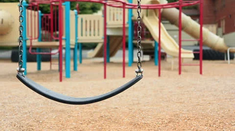 Abandoned swings on an empty playground Video stock 23667906