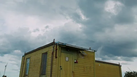 Abandoned tiny house made from wooden container. Shack in the middle of Video stock 147407248
