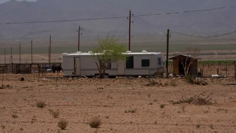 An abandoned trailer home in the desert southwest Stock Footage 307854553