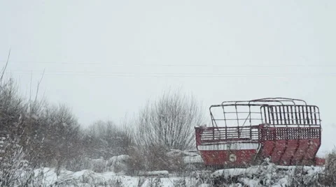 Abandoned trailer on winter field Stock Footage 58907031