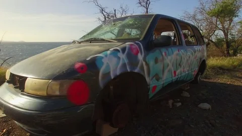 Abandoned van, car, destroyed, wrecked,  Graffiti Art. Aerial Fly Around Stock Footage 72075657