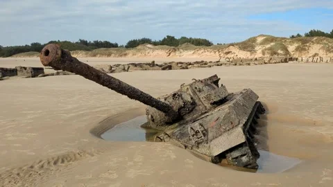 Abandoned war damaged tank half-sunk in sands in Kinmen beach Stock Footage 321624153
