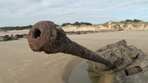 Abandoned war damaged tank half-sunk in sands in Kinmen beach Stock Footage 321624772
