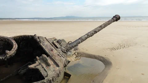 Abandoned war damaged tank half-sunk in sands in Kinmen beach Stock Footage 321624833
