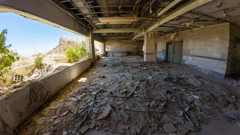 Abandoned war torn Building Interior with Sunlit Debris Stock Photos