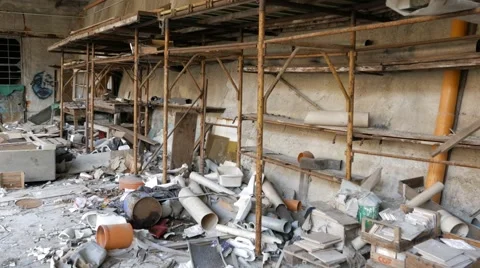 Abandoned warehouse full of junk and old scaffolding Stock Footage 58756122