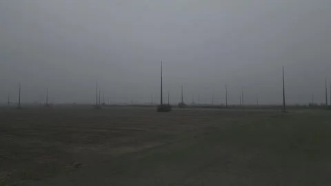 Abandoned Wind Farm Construction in Mist - Unfinished Renewable Energy Project Stock Footage 330496378