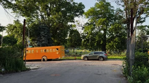 Abandoned Yellow School Bus in Open Urban Lot, Bushwick Stock-Footage 337430489