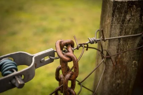 Abandoned zone with rusty chain and padlock Stock Photos