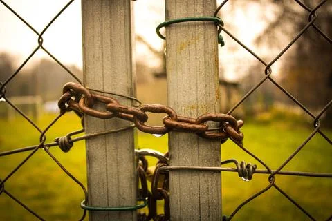 Abandoned zone with rusty chain and padlock Stock Photos