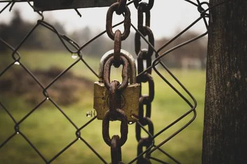 Abandoned zone with rusty chain and padlock Stock Photos