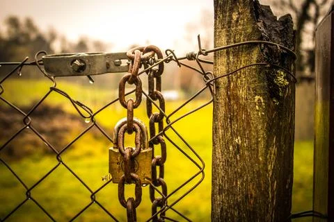 Abandoned zone with rusty chain and padlock Stock Photos