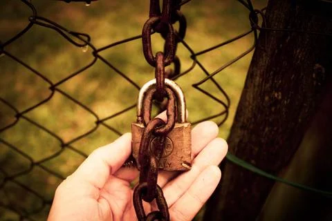 Abandoned zone with rusty chain and padlock Stock Photos
