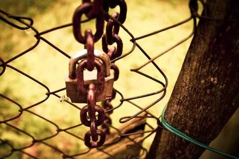 Abandoned zone with rusty chain and padlock Stock Photos