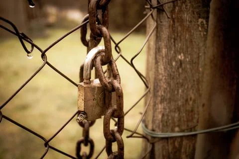 Abandoned zone with rusty chain and padlock Stock Photos