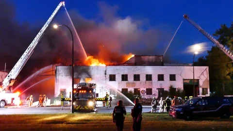 Abandonned building in flames Stock Footage 115973402
