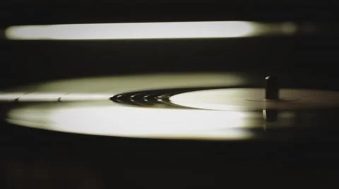 ABBEY ROAD CIRCA 2013: Close up pano of a record player playing a vinyl Stock Footage 40770965