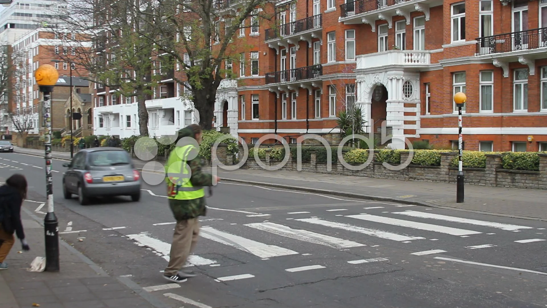 Happy to Help! Man charges tourists £4 to take their picture at Abbey Road  zebra crossing made famous by The Beatles | Daily Mail Online