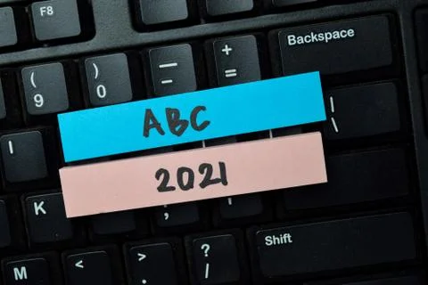 ABC 2021 write on sticky notes isolated on office desk. Stock Photos
