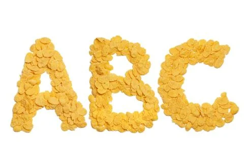 Abc letters made of cornflakes over white background Stock Photos