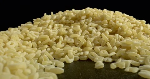 Abc pasta falling on pile of them. Whole wheat spaghetti close up. Alphabet kids Video stock 148519964