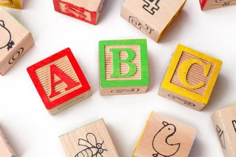 Abc playing cubes arranged over white background Stock Photos