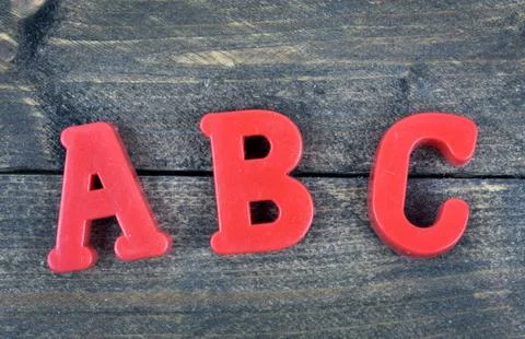 ABC on wooden table Photos