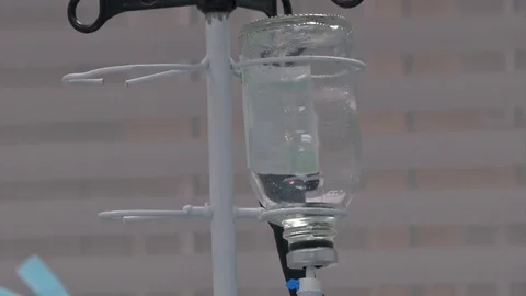 Abdominal liposuction. Selective focus Infusion bottle with IV solution in the Stock Footage 83196076