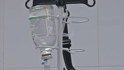 Abdominal liposuction. Selective focus Infusion bottle with IV solution in the Stock Footage 83199508