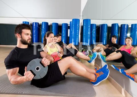 Abdominal plate training core group at gym Stock Photos