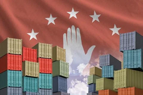 Abkhazia flag and big stack of shipping cargo containers in docks with sky Foto stock
