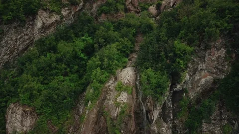 Abkhazia, mountain streams come together and form a mountain river, top view Vidéo 201036764