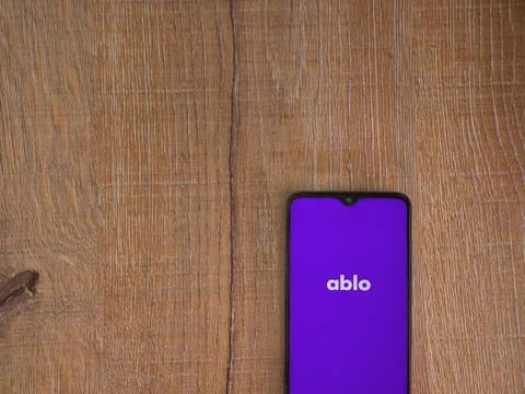 Ablo app launch screen with logo on the display of a black mobile smartphone  Stock Photos