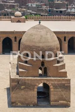 Ablution fountain and minaret of Ibn Tulun historic mosque Stock Photos