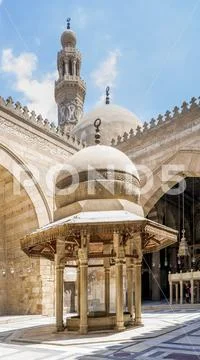 Ablution fountain at historic Sultan Barquq Mosque with dome and minaret Stock Photos
