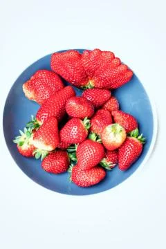 Abnormal strawberry shape in a plate Stock Photos