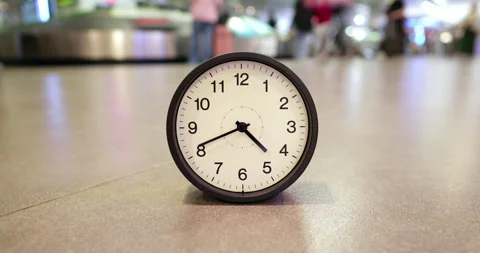 Abnormal time lapse of clock spinning fast on airport floor Stock Footage 345553318